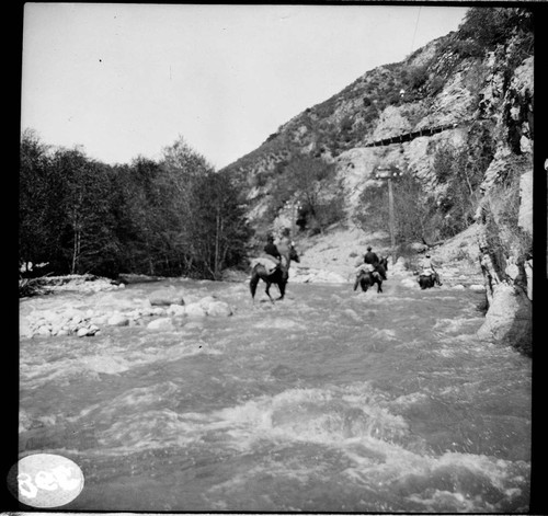 People riding horses in Santa Ana River Canyon along the transmission line