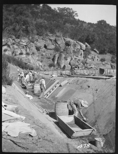 A construction crew plastering a ditch at Tule Plant