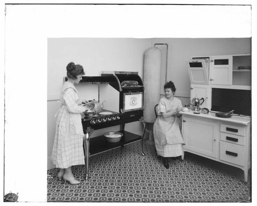 Hughes range and water heater in studio kitchen with Hoyt