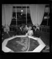 People reviewing sale of parcels on a plot map for an upscale housing development