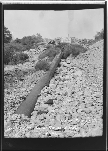 Sierra pipeline [penstock] showing pipe below tunnel in collapsed condition