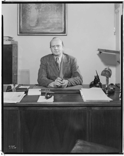 Manager of Beverly Hills Printing Office at his desk