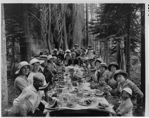 A large group of Big Creek families enjoying a rustic picnic