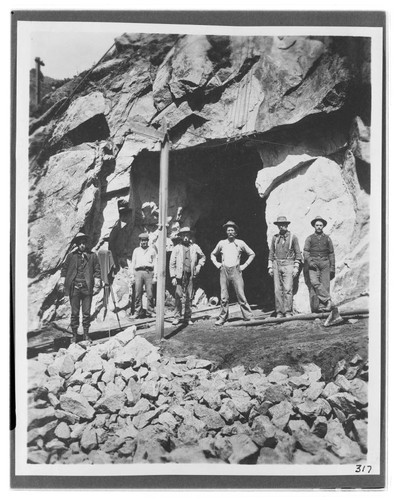 The six man surveying crew standing at the mouth of the tunnel at Kern River #1 Hydro Plant