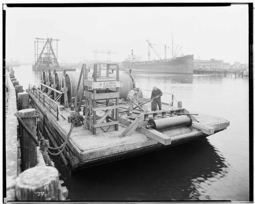 Distribution, Underground - Four reels of sub-marine cable on barge at Proctor & Gamble Plant