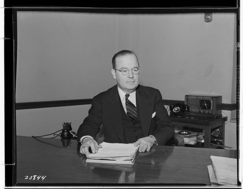 R.G. Kenyon at desk