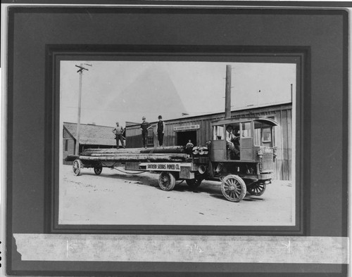 Southern Sierras Power Company's big Alco truck hauling a load of poles out to Elsinore, 1913