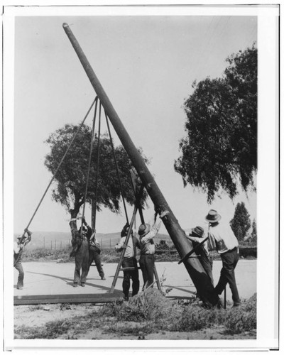 Raising a power pole using gin-poles and lots of muscle, during construction of the line to Perris, 1912