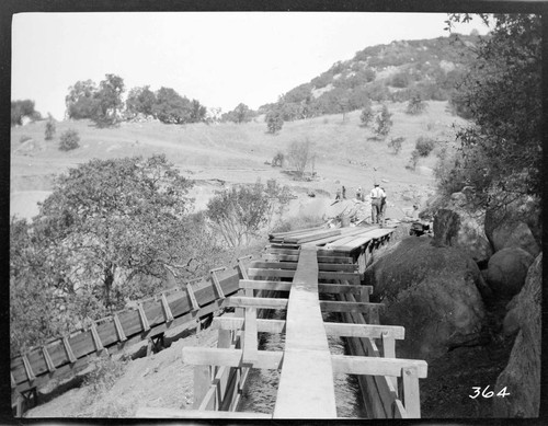 A construction crew working on the forebay reservoir of the Tule Plant