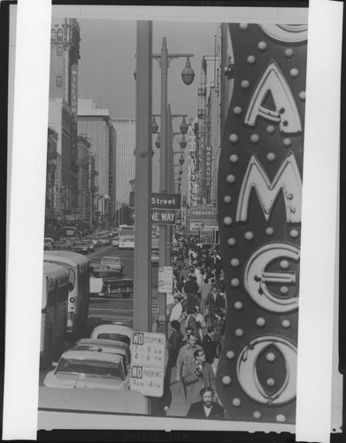 Crowd on a city street (near 5th Street and Coast Federal Savings building); and a dense crowd in an open field