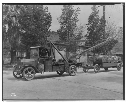 Truck and "Take Off" pole derrick with trailer