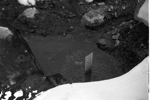 Portal Powerhouse - r-notch weir near outlet conduit at toe of forebay dam. Staff gage reads .418