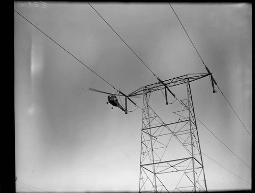 Helicopter patrolling Transmission Line