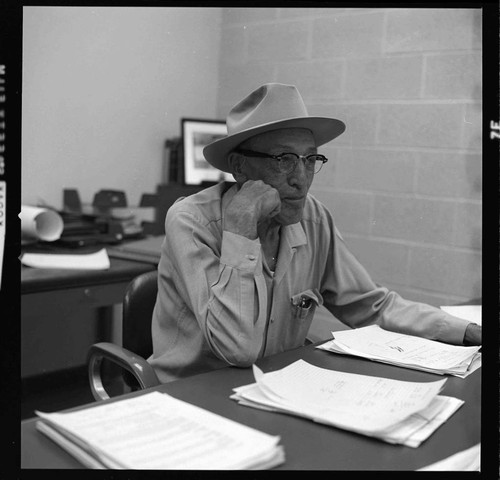 Hydro Generation Supervisor E. I. Bulpitt at his desk