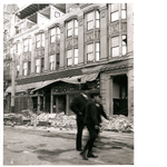 Storefront on Washington Street between 12th and 13th Streets in downtown Oakland, California, following the April 18, 1906, earthquake showing building damage and fallen brick and wires