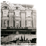 Smith Brother's Kodaks storefront on 13th Street between Washington Street and Broadway in downtown Oakland, California, following the April 18, 1906 earthquake showing building damage and fallen brick and wires