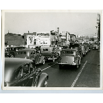 Automobiles traveling south along East 12th Street near 22nd Avenue in the San Antonio district of Oakland, California