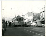 Passengers boarding the Key System number 10 streetcar on Piedmont Avenue at 41st Street in front depot in the Broadway Heights district of Oakland, California