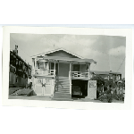 Duplex with open garage door in the Sunset Manor subdivision of Oakland, California