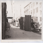 Packing crates and metal machinery on 6th Street looking south from Webster Street in Oakland, California's Chinatown