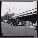 Delivery trucks lined up in front of G. Bonora Co., wholesale fruit and produce. Franklin Street between 3rd and 4th Streets in the Produce district of Oakland, California