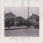 Men stand outside Honolulu Bakery on the corner of 29th Avenue and East 7th Street in the Kennedy Tract district of Oakland, California, afternoon of February 11, 1935