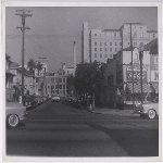 Hawthorne Avenue looking east from Telegraph Avenue in the Pill Hill district of Oakland, California. Peralta Hospital, with its ice plant, boiler room, and smoke stack, and Knapp's Market in view