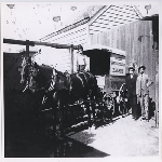 Philip Orio, second from left, and Stefano Persoglio, far left, stand near the French-Italian Bakery's horse-drawn delivery cart in the Temescal district of Oakland, California