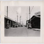 Looking east on 2nd Street from Harrison Street in the Produce district of Oakland, California, July 9, 1935. Hogan Lumber Co. in view