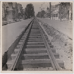 Tracks being laid on Telegraph Avenue between 24th and 25th Streets looking north in the Pill Hill district of Oakland, California