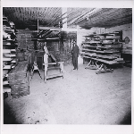 Stefano Persoglio, on right, and a baker stand in front of Liberty Bakery's brick oven in the Temescal district of Oakland, California