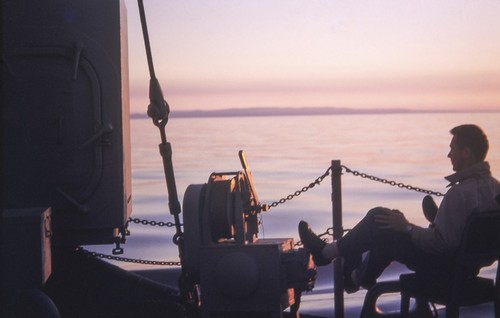 George A. Shumway, Jr. on deck at sunset