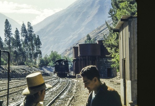 Men, Train and Railroad Tracks in Andes