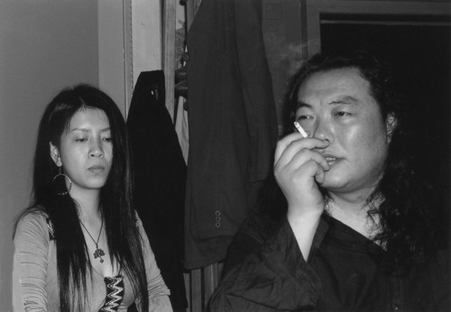 Mei Hualuo and Qi Guo at informal poetry reading in Momo's apartment in Shanghai