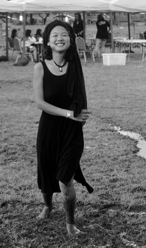 Young Chinese woman dancing at a music festival 1 of 2