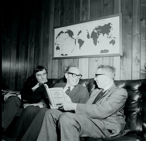William A. Nierenberg (center) presenting book to Jean-Pierre Levy, and Michel J.M. Baguery