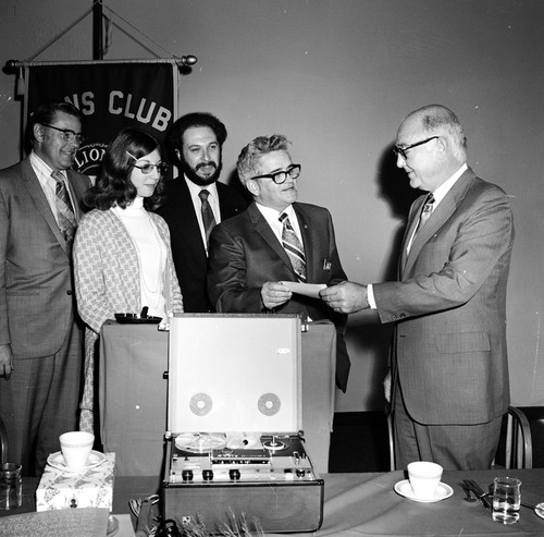 Robert Jackson (center) of the Pacific Beach Lion's Club presenting donation to Chancellor William D. McElroy