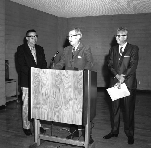 Herbert York (left), Francis Smith (center) and an unidentified man during ceremony commemorating the 3/4 million books at UC San Diego Libraries