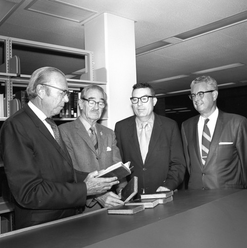Melvin Voigt, Francis Smith, Herbert York, and an unidentified man during the ceremony commemorating the 3/4 million books at UC San Diego Libraries