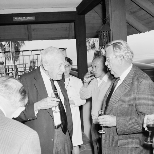 Roger Revelle and Elizabeth Noble Shor (behind) at Roger's 80th birthday party