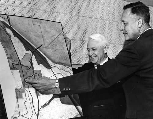 Roger Revelle (right) and Donald W. McLaughlin looking at map of proposed UC San Diego campus site