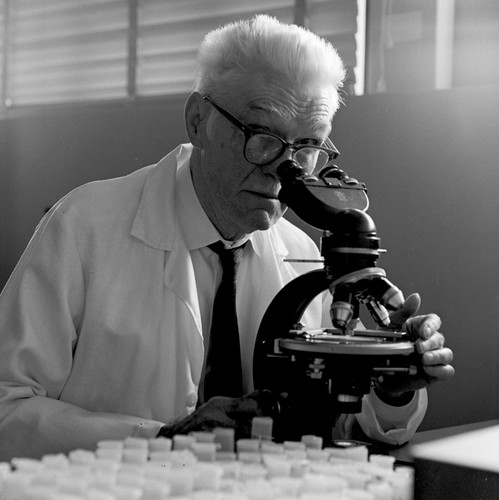 Milton Nunn Bramlette with microscope