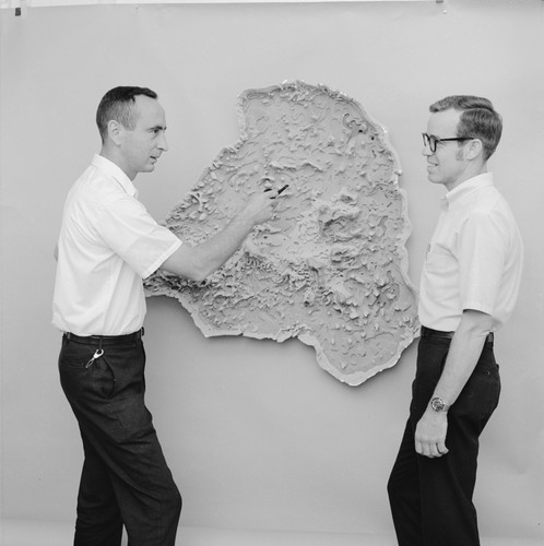 William A. Newman and Joseph Curray with a model of Truk Atoll