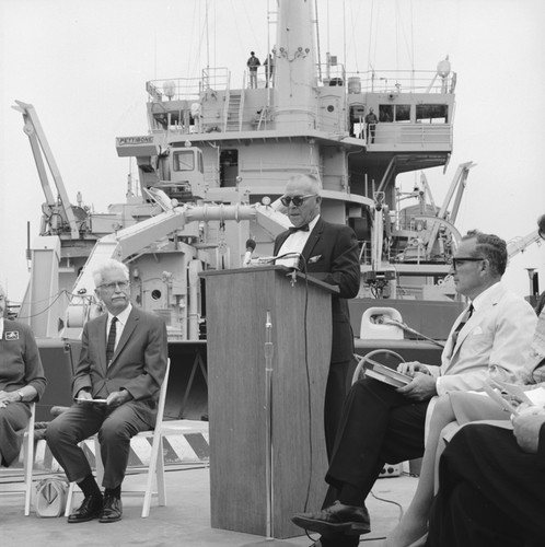 Captain Noel L. Ferris, with William A. Nierenberg (right) and Marston Cleaves Sargent (left), speaking at the dedication of R/V Melville