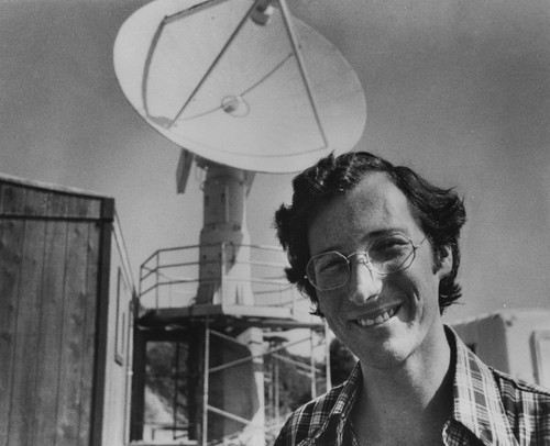 Robert L. Bernstein with new satellite facility in background, Scripps Institution of Oceanography