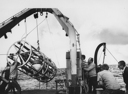 Walter Heinrich Munk (far right) and unidentified aboard the R/V Thomas Washington