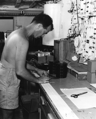 George G. Shor recording seismic waves in a ship laboratory