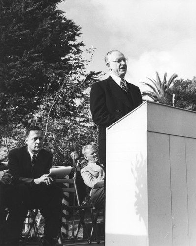 Robert Gordon Sproul (at podium) and Roger Revelle (seated), dedication of Thomas Wayland Vaughan Aquarium Museum, Scripps Institution of Oceanography