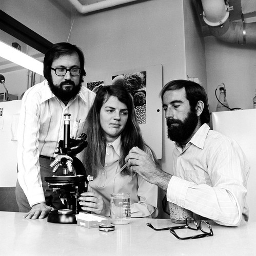 David Epel (left), Mia Tegner (center), and Victor Vacquier, Jr. (right) working in a laboratory, Scripps Institution of Oceanography