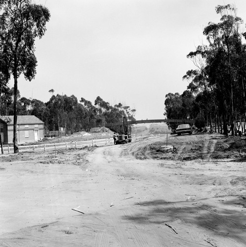 Construction of Gilman Drive on UC San Diego campus, near pedestrian bridge